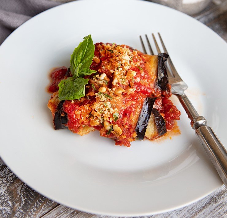 Eggplant rolls with ricotta filling topped with tomato sauce